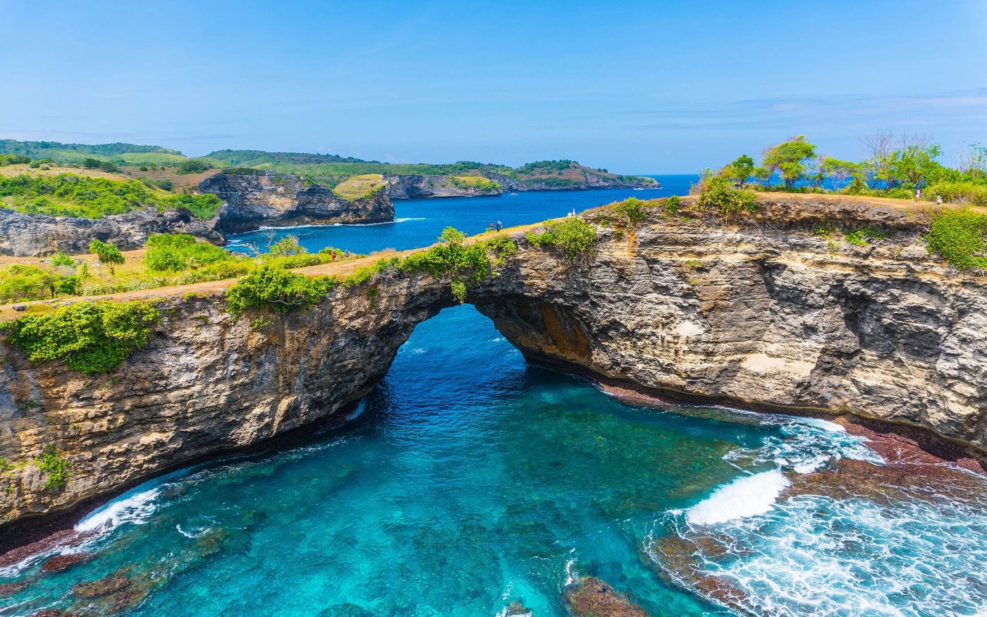 Natural rock arch over the turquoise lagoon at Broken Beach, Nusa Penida