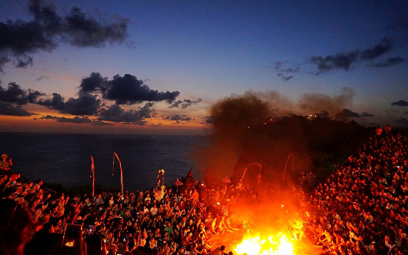 Fire scene of the Ramayana Kecak dance at dusk on the Uluwatu cliff top