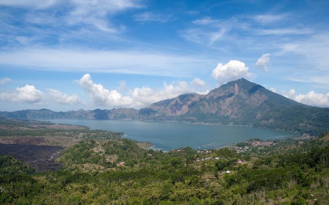 Crescent-shaped Lake Batur and Mount Abang seen from the Kintamani caldera rim