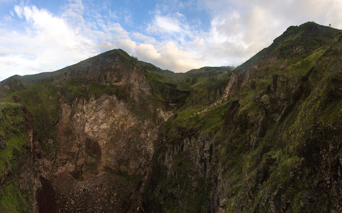 Green volcanic crater rim of Mount Batur in the Kintamani highlands