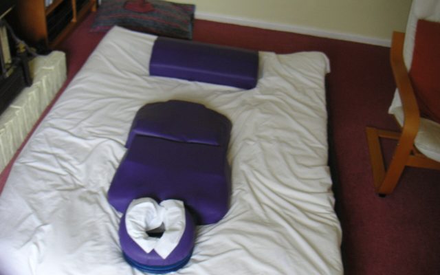 Shiatsu futon mat with bolster and face cushion ready for a treatment