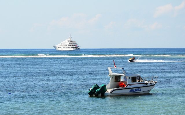 Speedboat and jet ski on the blue water off Tanjung Benoa, Bali