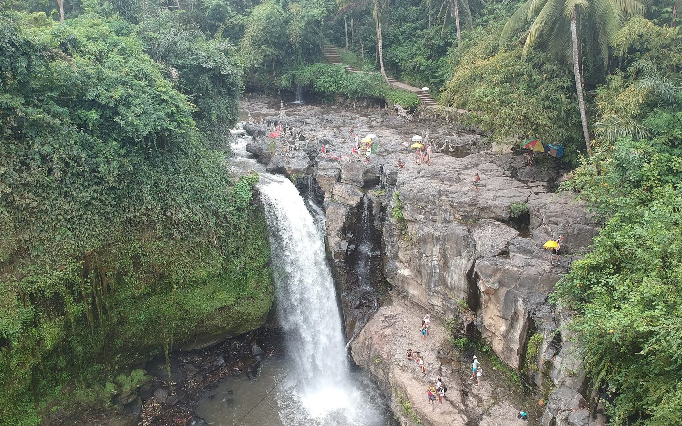 Tegenungan Waterfall plunging into a pool surrounded by tropical jungle near Ubud
